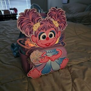 Loungefly Pink and Purple Character Backpack